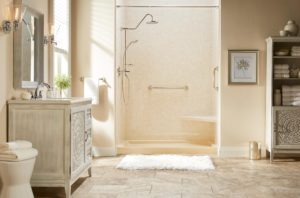 Walk-in shower with built-in seating and grab bars to improve accessibility