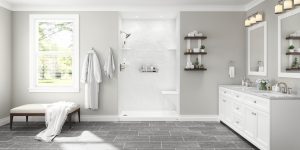 White walk-in shower with built-in seating. Gray bathroom with tile floor, white cabinetry, and twin sinks